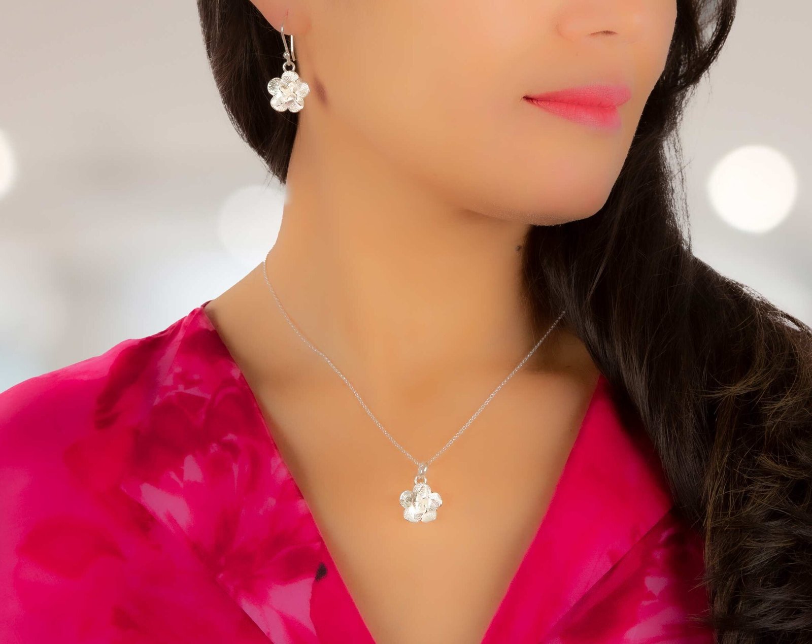 Woman with handmade silver jewelry